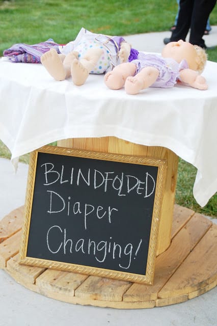 Baby Shower Games That Are Actually Fun - blinfolded diaper changing game