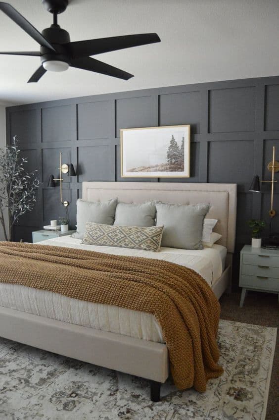 Navy blue accent wall with gray walls